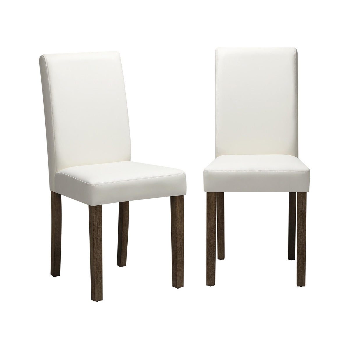 A pair of white upholstered dining chairs with brown wooden legs.